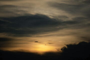 Fototapeta premium A dark sky with a sun in the middle