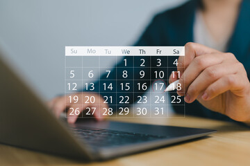 Businessman manages time for effective work. Calendar on the virtual screen interface. Highlight appointment reminders and meeting agenda on the calendar. Time management concept.