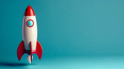 Toy rocket against blue background, minimalistic design concept