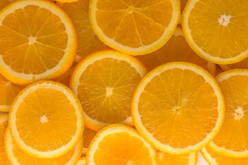 Closeup of sliced juicy oranges textured background