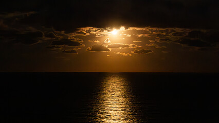 Lunar Serenity: Moonrise Over Tranquil Waters