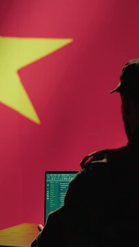 Vertical video Chinese engineer making troll accounts on social media promoting communist ideology. Software developer building algorithms to spread CCP government socialist doctrine, camera A