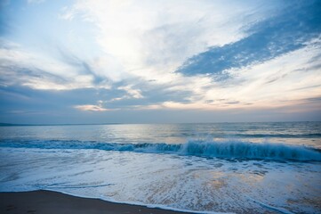 Ocean washing onto shore at Mui Ne Vietnam at sunrise famous surfing town