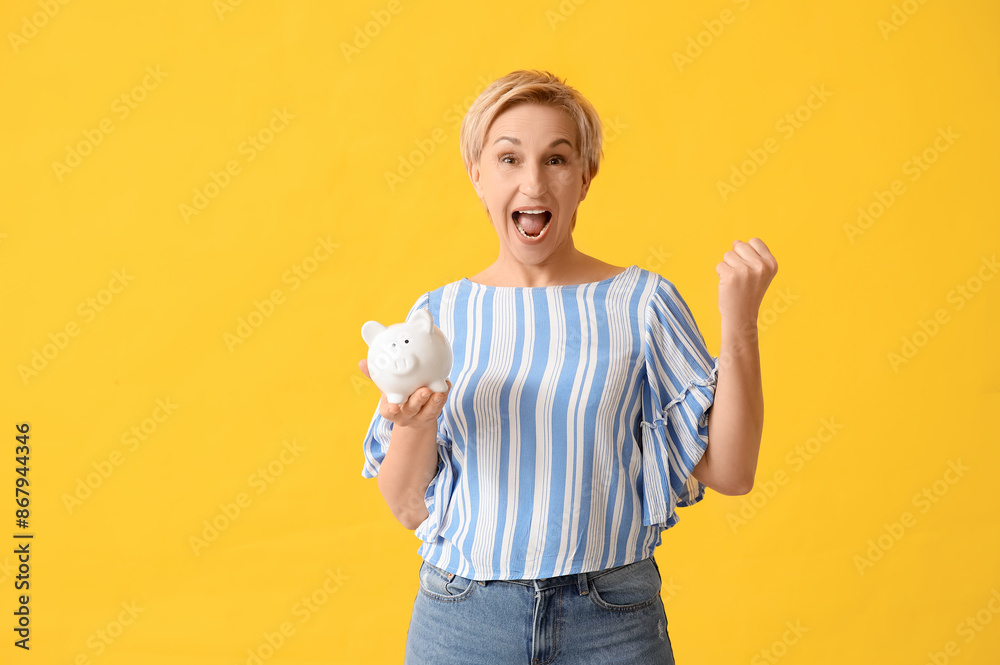 Canvas Prints emotional mature woman with white piggy bank on yellow background