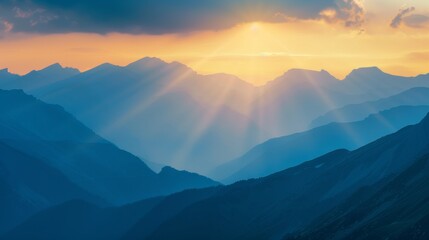 Fototapeta premium Sunset over mountain range with sunlight rays, tranquil scene. Nature photography and scenic landscape concept