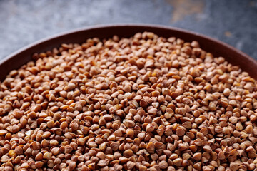Buckwheat Grains on Plate, Healthy Cereal Concept, Close Up