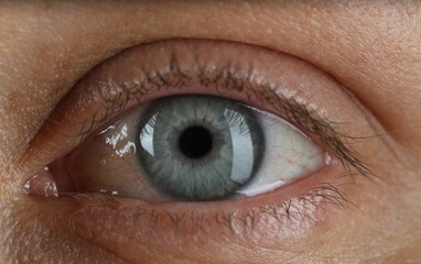 Woman with beautiful blue eyes, macro photo