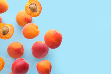 Flying apricots on blue background