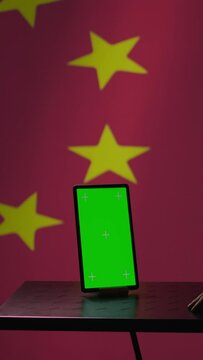 Vertical video Chinese engineer uses green screen tablet to make fake accounts on social media promoting communist ideology. Technician doing cybersecurity job for CCP government with mockup device