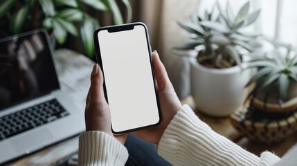 Person Holding Smartphone with Blank Screen