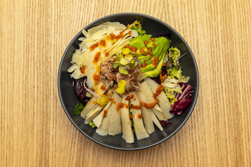 a salad that focuses on proteins such as chicken, tuna, etc.