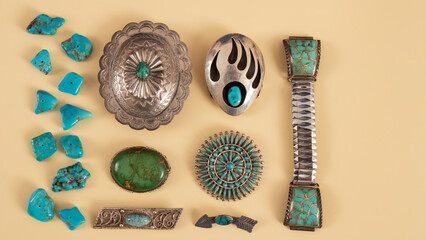 Old silver jewelry with blue turquoise. Southwestern handcraft. Isolated broches, stones and...