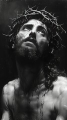 Christian figure looking at heaven in black and white