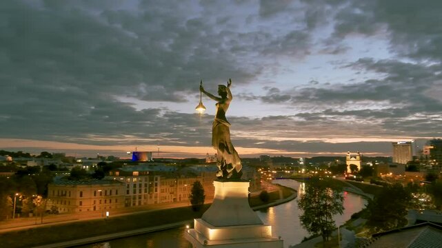 Aerial orbit view of Vilnius Old Town at dusk. One of the largest surviving medieval old towns in Northern Europe. Sunset landscape of Old Town, Neris river and Gediminas' hill. Lithuania.