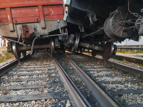The wreck of railway wagons. An accident on the railway. A railway carriage derailed during daylight hours. The railway car as a result of the accident came off the rails. 