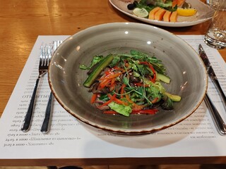 Leafy greens and sliced cucumbers