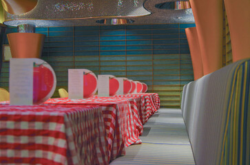 Casual colorful trattoria pizzeria dining room a la carte restaurant onboard luxury cruiseship or...
