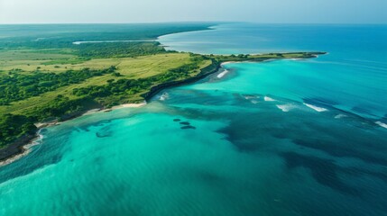 Obraz premium aerial shot of a serene coastline, with turquoise waters gently meeting sandy beaches.