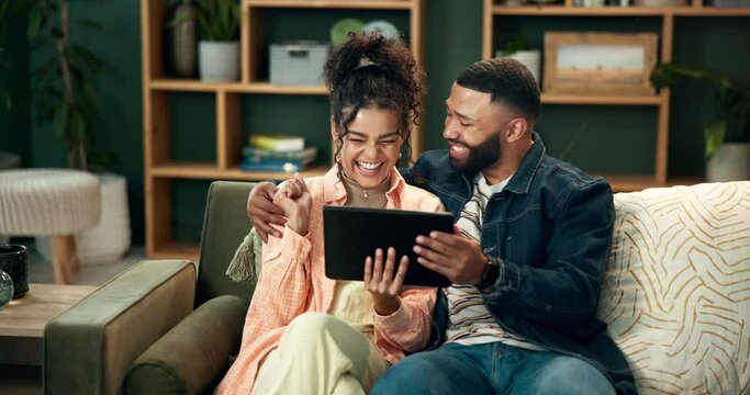 Love, kiss and couple on sofa with tablet excited for news, feedback or house loan approval. Digital, ecommerce and people embrace in living room online for home renovation, planning or mortgage deal - Powered by Adobe