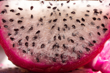 close up of a slice of a tropical and exotic fruit called pitahaya or dragon fruit