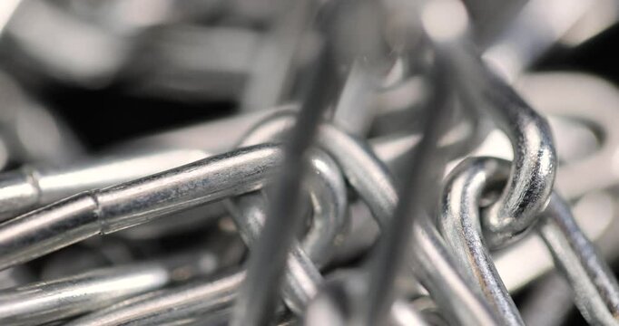 silver steel chain on a black background, steel chain links connected together