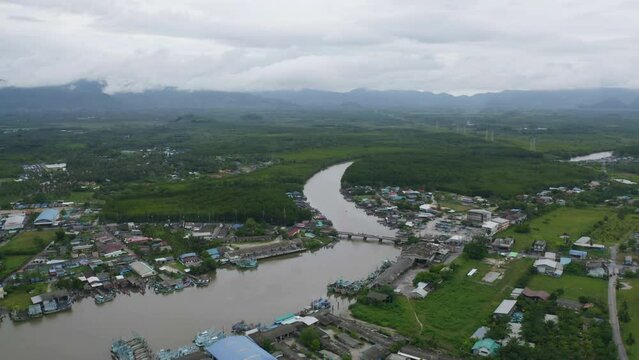 Aerial view of Ranong City, The Floating village urban city town houses, lake sea or river. Nature landscape fisheries and fishing tools, Thailand. Aquaculture farming