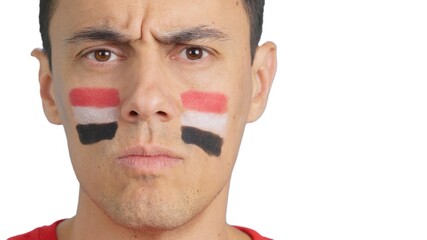 Serious man with a egyptian flag painted on the face