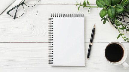 Fototapeta premium Office desk with a blank notebook and pen