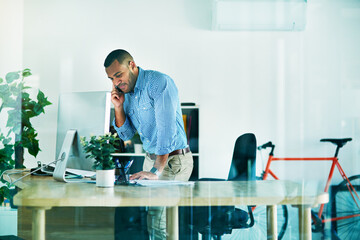 Phone call, talking and business man at desk for conversation, confirm meeting or negotiation in office. Advertising manager, discussion and employee for planning, communication or conduct deal