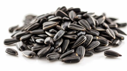 Pile of sunflower seeds on white background