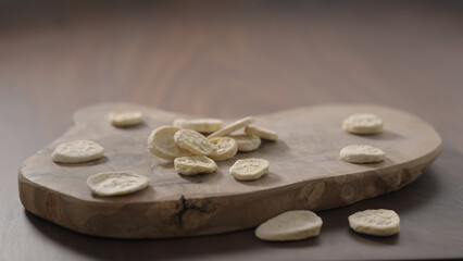 freeze dried banana chips on olive board