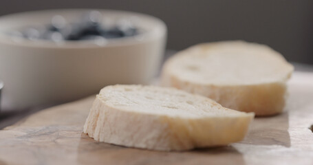 ciabatta bread slice on olive board