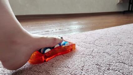 Foot and foot massager. the foot moves on the rollers for relaxation - Powered by Adobe