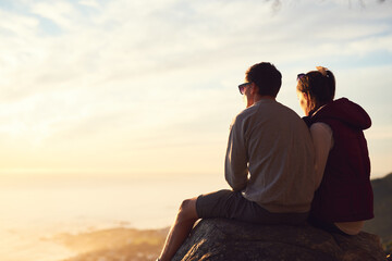 Fototapeta premium Relax, view and couple hiking on mountain for travel, outdoor adventure and journey in nature. Back, sky and people on peak together for holiday break, summit or trekking to explore by mockup space