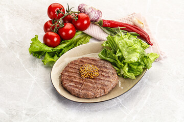 Frilled beef burger cutlet with iceberg
