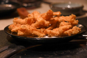 Delicious  tempura on black plate, deep fried Japanese food