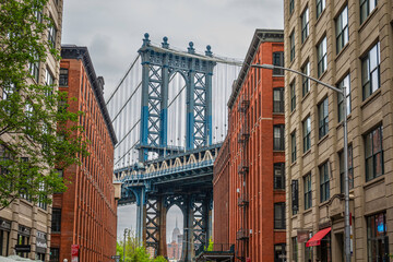 Brooklyn Bridge shot between two building