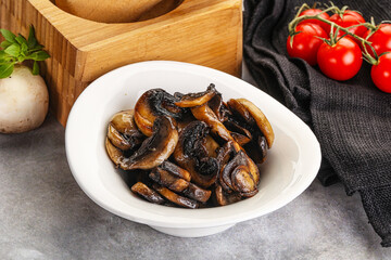 Roasted champignon mushrooms in the bowl