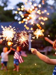 children celebrating independence day with sparklers and fireworks in backyard at dusk.