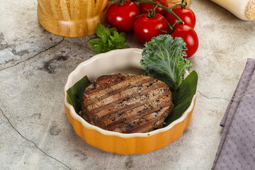 Grilled tuna medallion in the plate