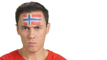 Serious man with a norwegian flag painted on the face