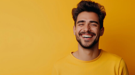 Obraz premium Happy joyful smiling young indian man looking aside up thinking of new good opportunities, dreaming, feeling inspired and proud standing isolated on yellow background. Portrait