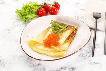 Russian pancake with red caviar