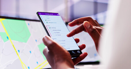 Busy African American Woman Using Grocery Shopping List Mobile App
