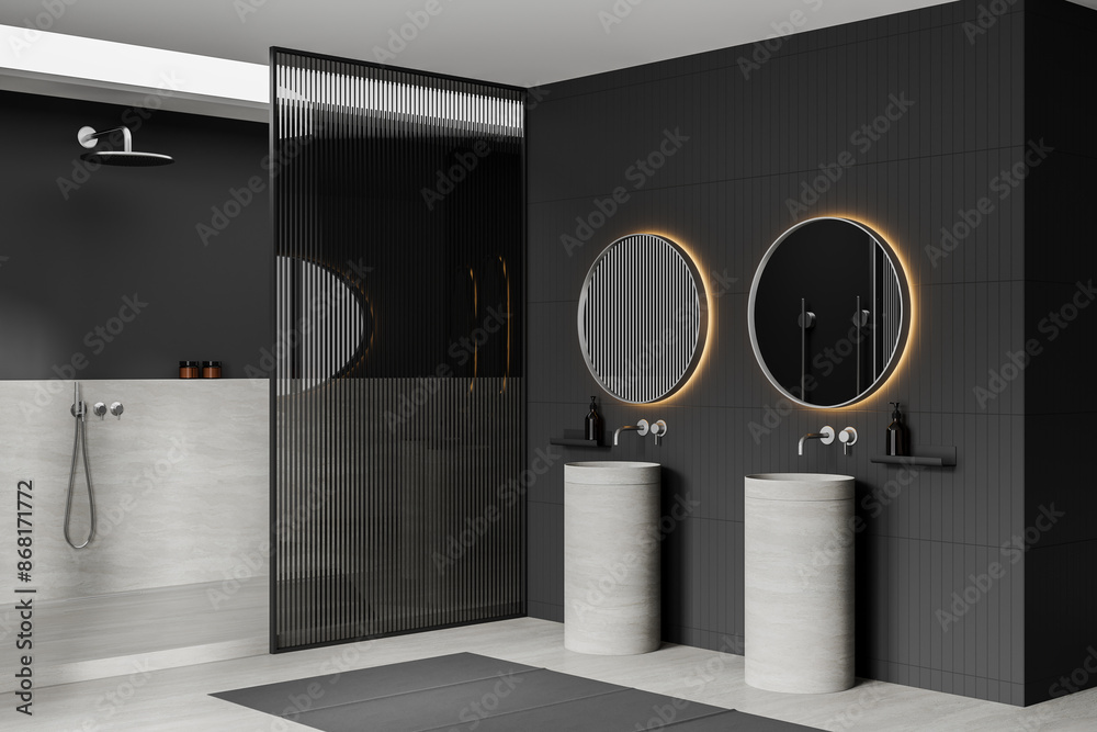 Wall mural modern bathroom interior with dark walls, round mirrors, and cylindrical sinks, minimalistic design,