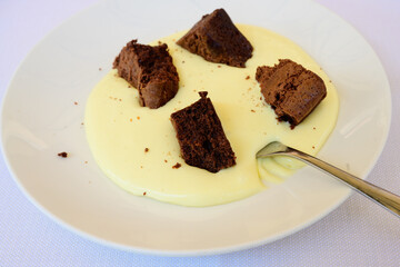 Tenerina Cake with Coffee amd Mascarpone Sauce called Torta tipo Tenerina, caffè e crema al mascarpone