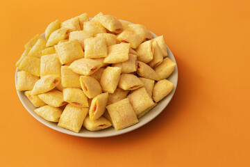 Cookies - corn cushions with strawberry flavored filling on a plate