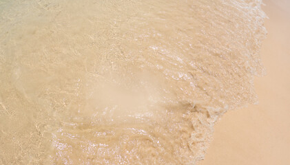 White sand on the seashore as a background