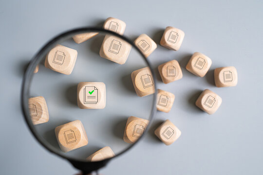 Search engine concept with magnifier looking into big data in archive information with AI tools in order to find the right and correct information. Big data and artificial intelligence for searching.