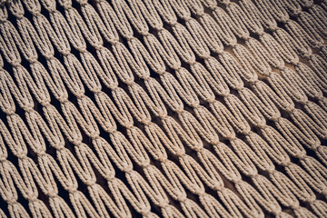 A detailed view of a knitted textile featuring a geometric design